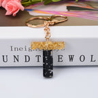 Carsine Black Pompom 26 Alphabets Keychain gold / T